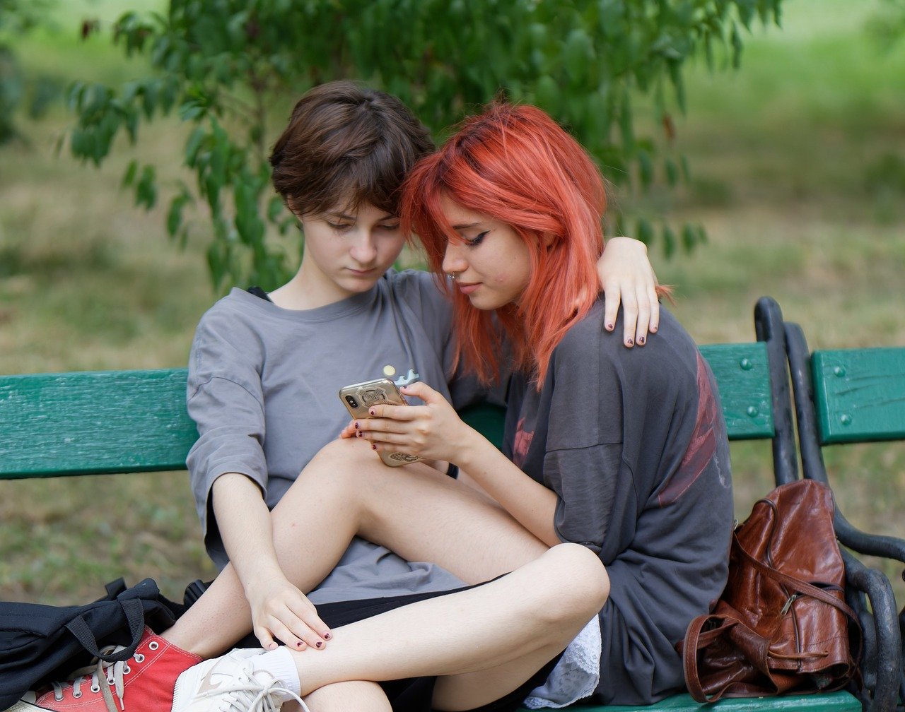 girls, two, friends, looking, together, smartphone, relaxing, bench, parka, lesbian, lesbians, couple, lgbtiqa, pride, pride month, world pride, smartphone, lesbian, lesbian, lesbian, lesbian, lesbian, lesbians, lesbians, pride, pride, pride month, pride month